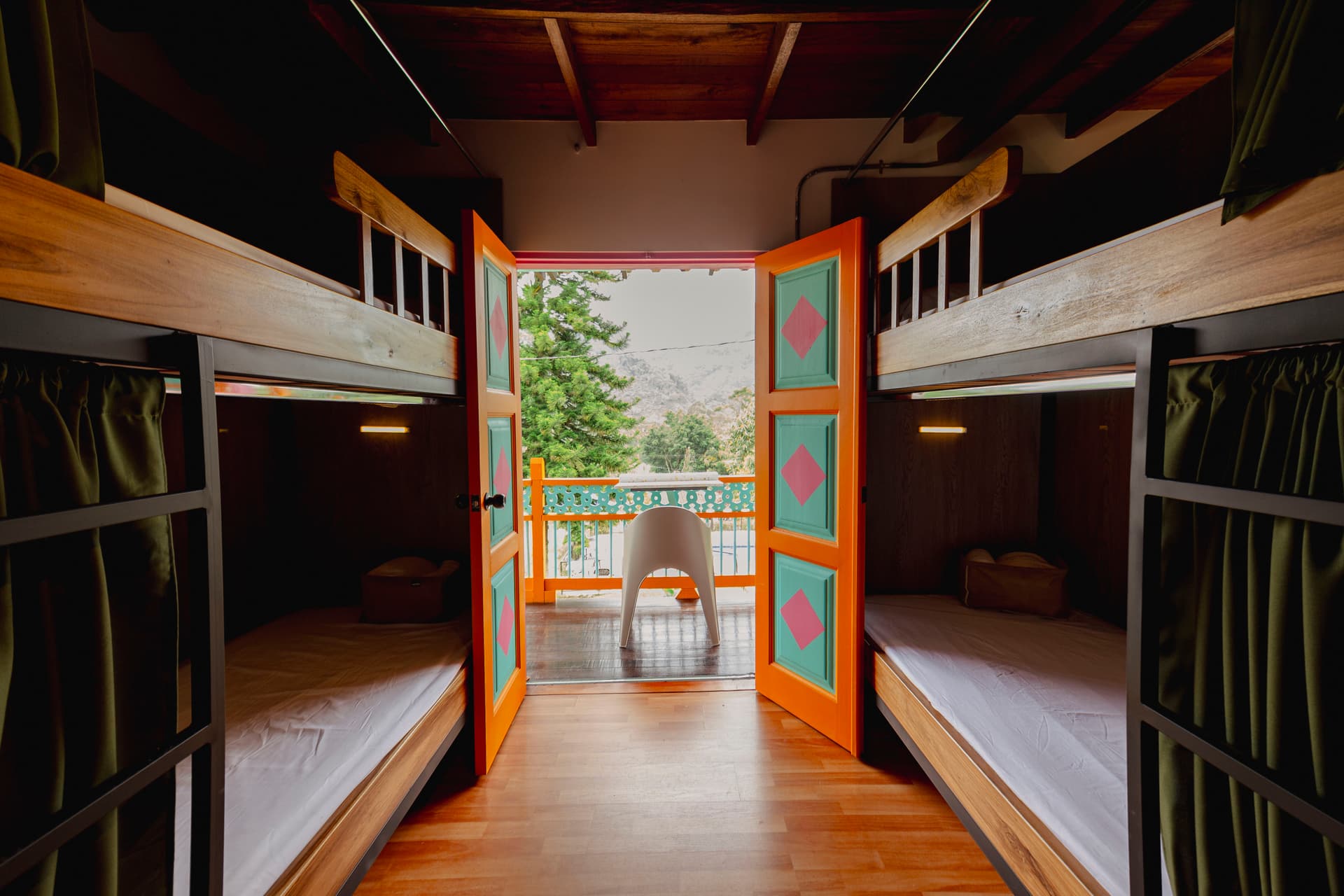 Rain falling over the green mountains surrounding Jardín Colombia with mist rolling through the valley