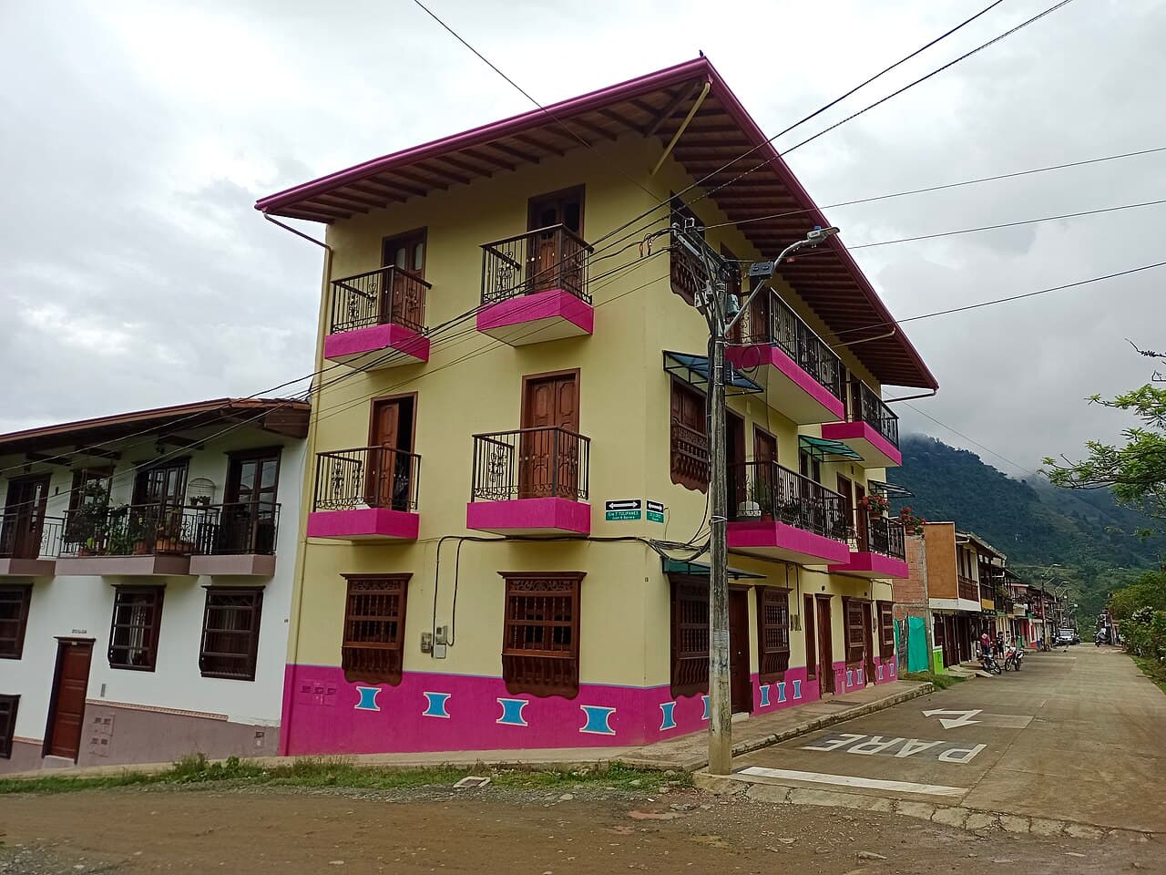Row of colorful colonial buildings with painted doors in Jardín, Antioquia