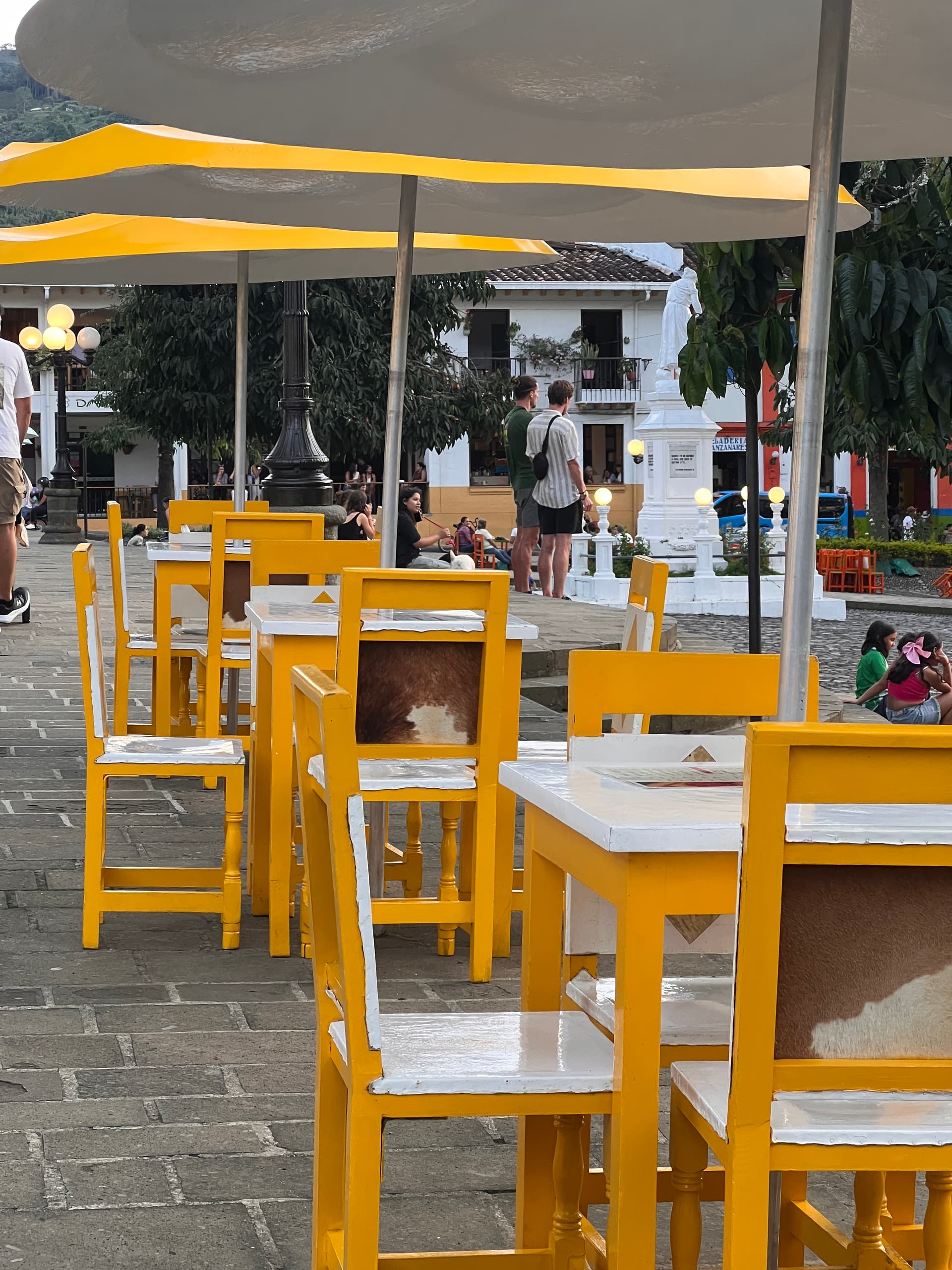 Colorful colonial buildings lining the streets of Jardín during a festive celebration